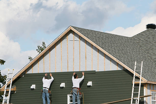 Professional Storm Damage Siding Repair technician working in Hooversville, PA